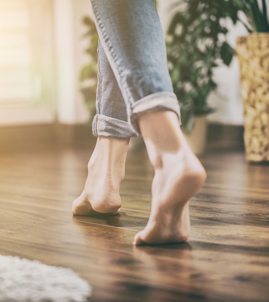 Floor,Heating.,Young,Woman,Walking,In,The,House,On,The